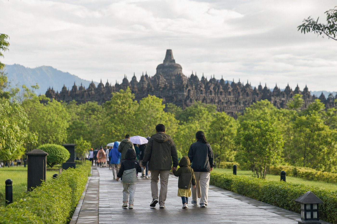 A family walking toward Borobudur temple
