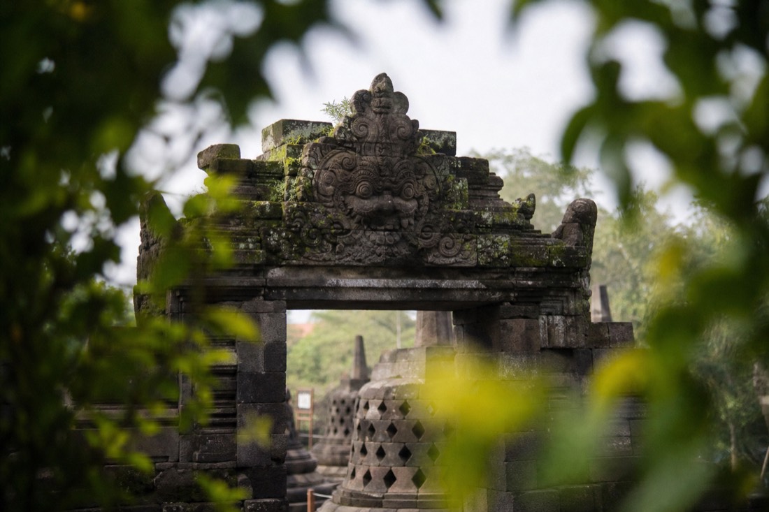 Carved kala head above a gateway of Borobudur temple