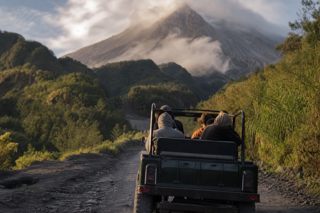 A jeep tour climbing the volcanic slopes of Mount Merapi